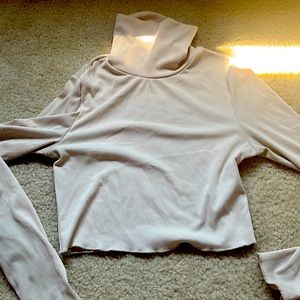 A size 4, cream colored turtle neck!